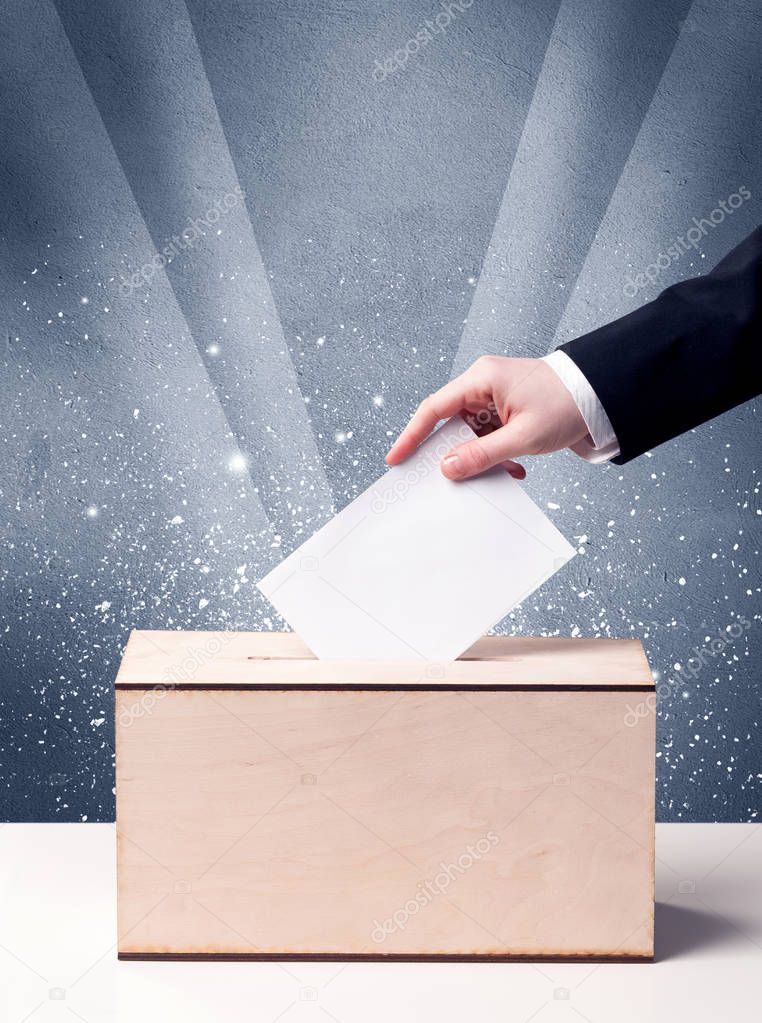 Ballot box with person casting vote