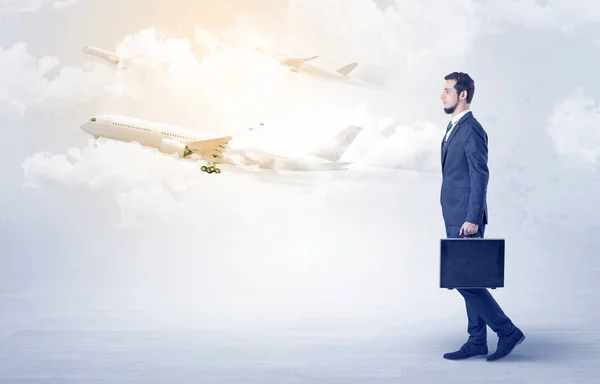 Businessman going somewhere with airplane — Stock Photo, Image