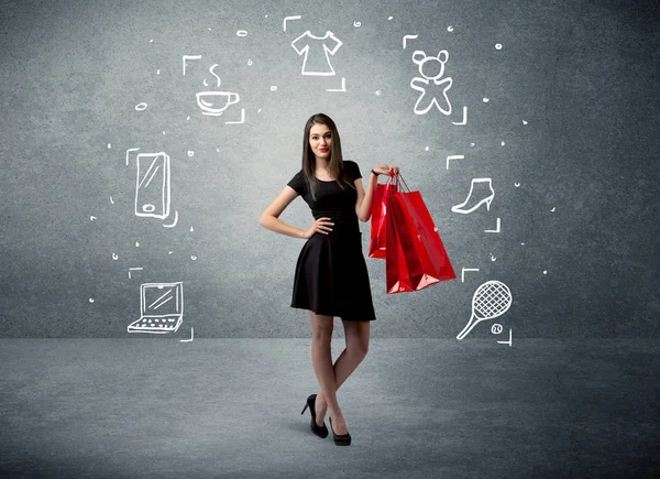 Mujer de compras con bolsos e iconos dibujados —  Fotos de Stock