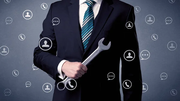 Handsome man standing with tool on his hand — Stock Photo, Image