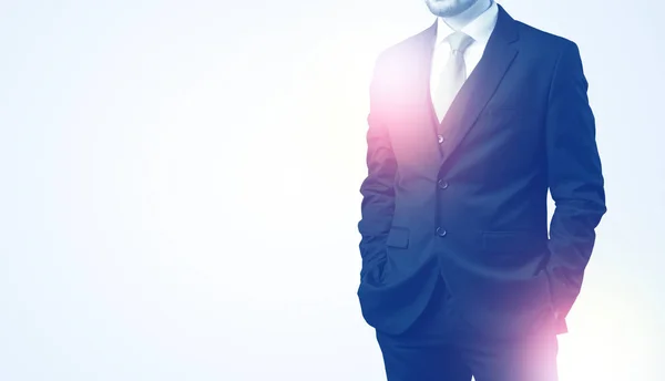 Young businessman standing and thinking — Stock Photo, Image