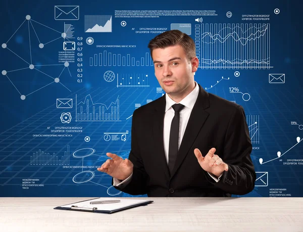 Businessman sitting at a desk — Stock Photo, Image