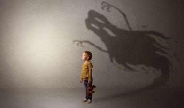 Scary ghost shadow behind kid clipart