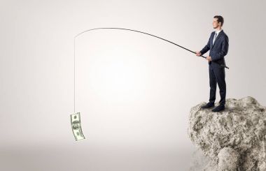 İşadamı Balık tutma Doları bir rock