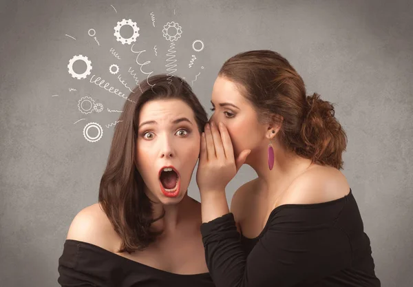 Girl telling secret things to her girlfriend — Stock Photo, Image