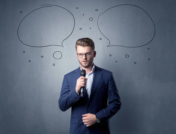 Businessman holding microphone — Stock Photo, Image