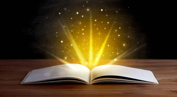 Yellow lights over book — Stock Photo, Image