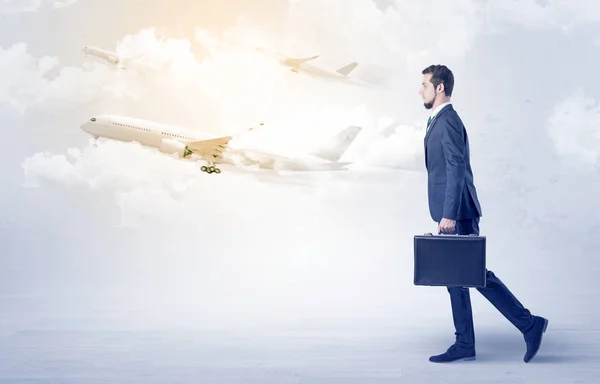 Businessman going somewhere with airplane — Stock Photo, Image