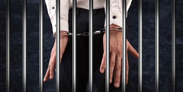 Close handcuffed man in jail — Stock Photo, Image