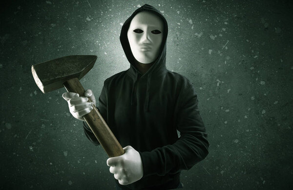 Armed villain in an empty dark room