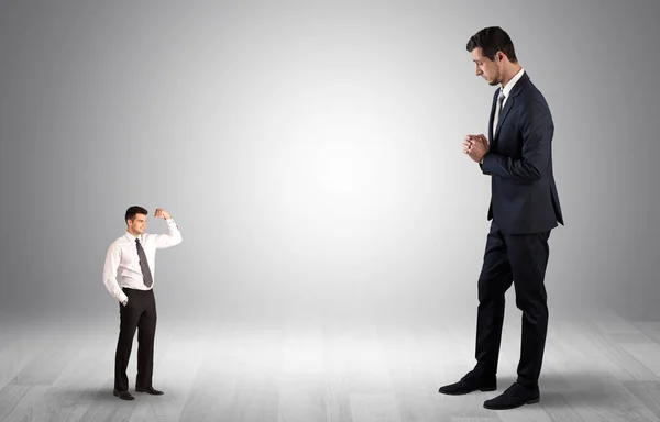 Giant businessman scared of small businessman — Stock Photo, Image