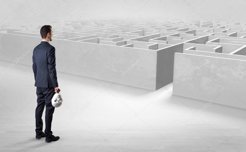Businessman starting a labyrinth challenge