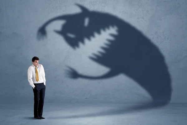 Business man afraid of his own shadow monster concept — Stock Photo, Image