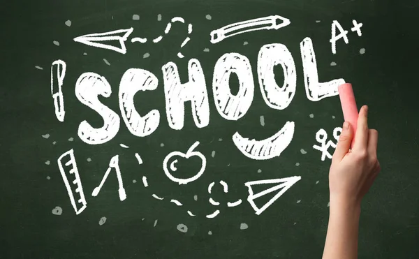 Hand writing on school blackoard — Stock Photo, Image