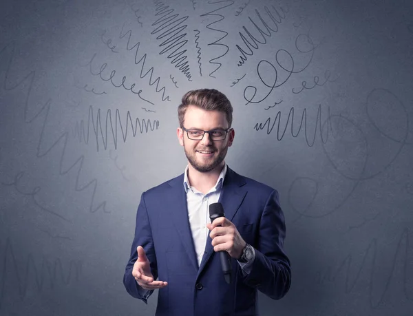 Businessman holding microphone — Stock Photo, Image