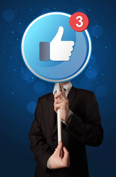 Geschäftsmann mit Facebook-Schild — Stockfoto