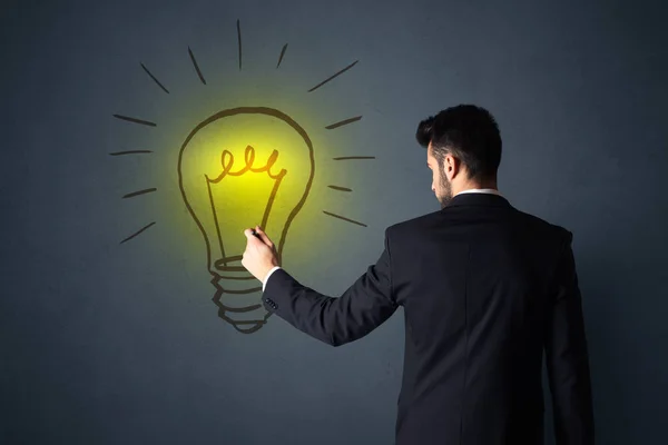 Businessman with lightbulb — Stock Photo, Image