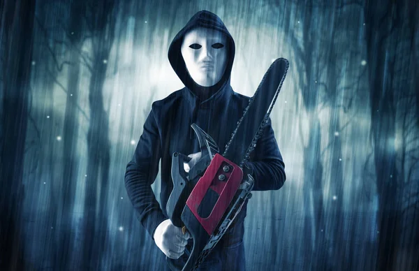 Armed hitman in dark nocturnal forest concept — Stock Photo, Image