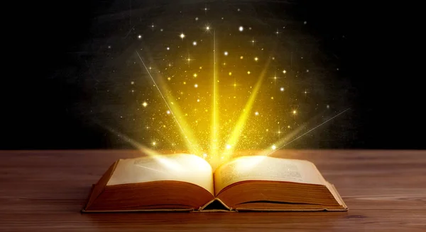 Yellow lights over book — Stock Photo, Image