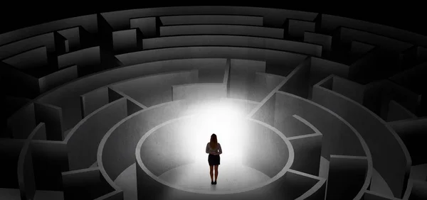 Woman choosing between entrances in a middle of a dark maze — Stock Photo, Image