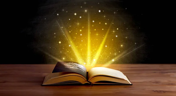 Yellow lights over book — Stock Photo, Image