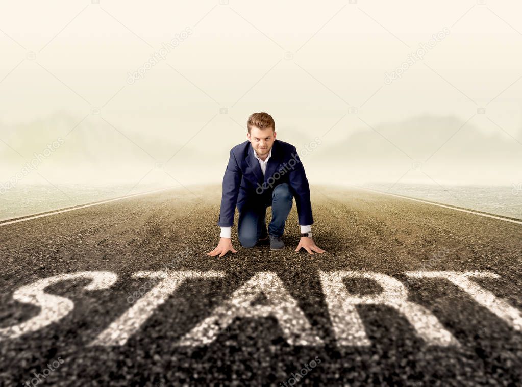 Businessman at start line