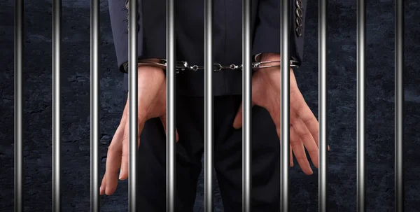 Close handcuffed man in jail — Stock Photo, Image