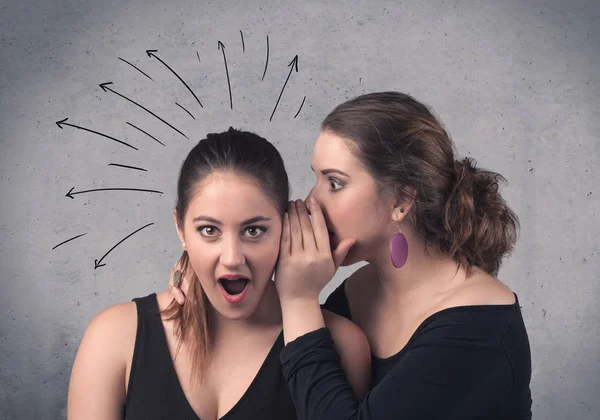 Girl telling secret things to her girlfriend — Stock Photo, Image