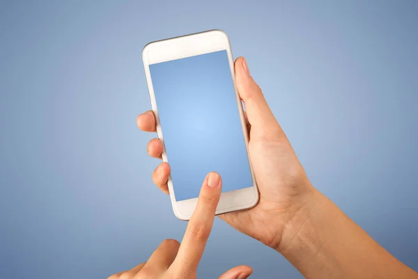 Female hand holding smartphone — Stock Photo, Image