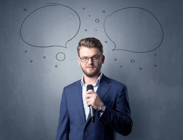 Businessman holding microphone — Stock Photo, Image