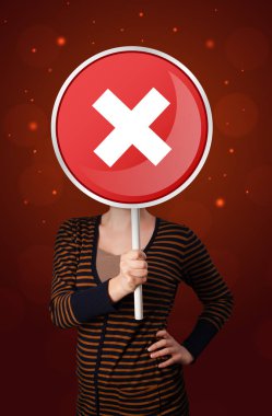 Tutan kadın x işareti