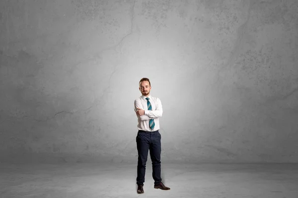 Alone businessman standing in a dark room — Stock Photo, Image