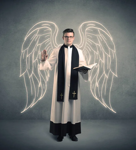 Young priest in giving his blessing — Stock Photo, Image