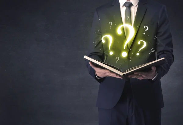 Businessman looking in a book. — Stock Photo, Image