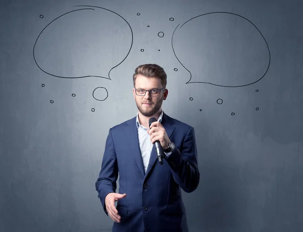 Businessman holding microphone — Stock Photo, Image