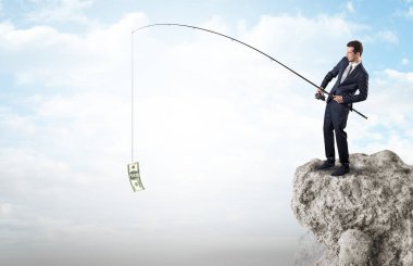 İşadamı Balık tutma Doları bir rock
