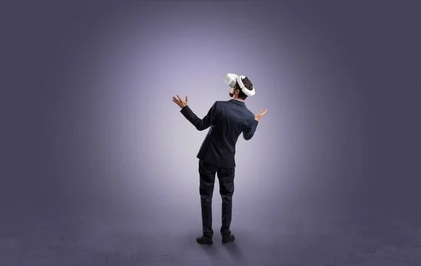 Businessman in an empty room with vr glasses — Stock Photo, Image