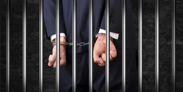 Close handcuffed man in jail — Stock Photo, Image