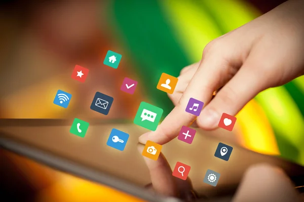 Fingers touching tablet with apps — Stock Photo, Image