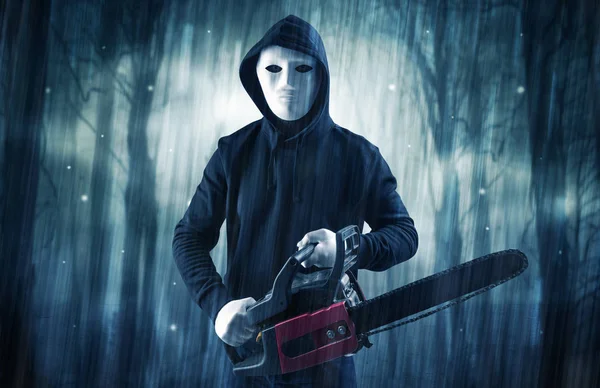 Armed hitman in dark nocturnal forest concept — Stock Photo, Image