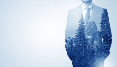 Businessman standing with mountain clipart