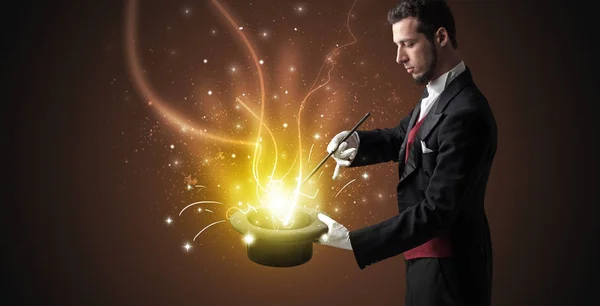 Magician hand conjure miracle from cylinder — Stock Photo, Image