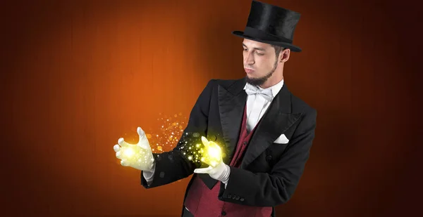 Illusionist holding superpower on his hand — Stock Photo, Image