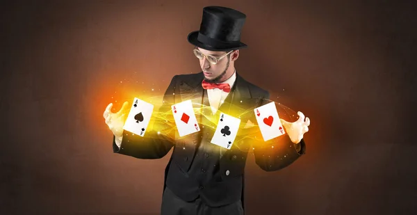 Illusionist making trick with magical play cards — Stock Photo, Image