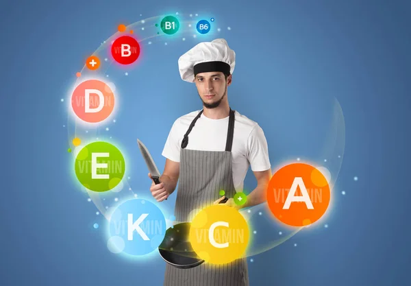 Handsome cook with vitamin concept — Stock Photo, Image