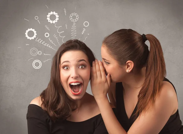 Girl telling secret things to her girlfriend — Stock Photo, Image