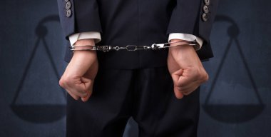 Arrested man with balance on the background clipart