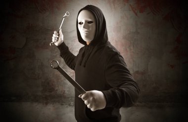 Armed assassin in an empty bloody room concept clipart