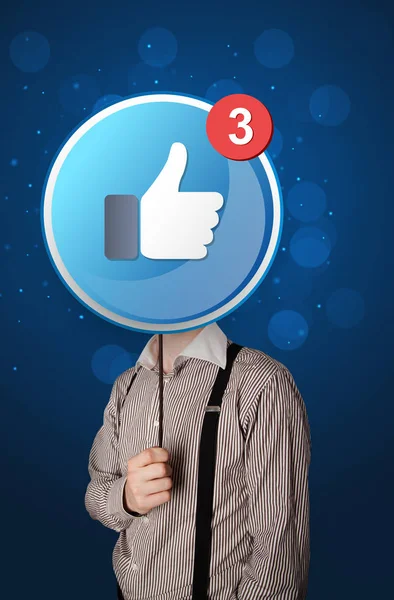 Geschäftsmann mit Facebook-Schild — Stockfoto