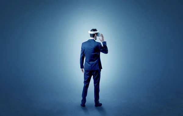 Businessman in an empty room with vr glasses — Stock Photo, Image